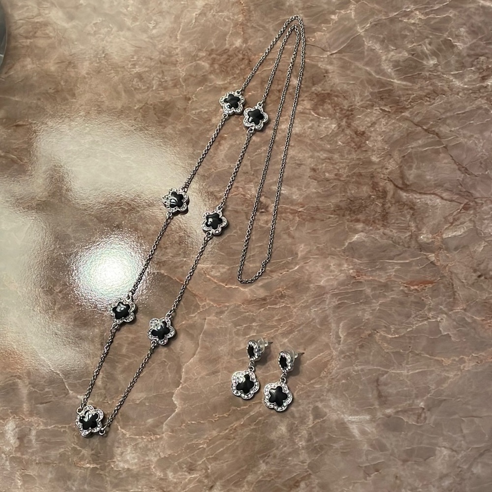 Black flower/faux diamond silver tone necklace and earring set.